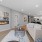 Wood-style flooring and built-in fireplace inside townhome at The Preserve at Stone Gate